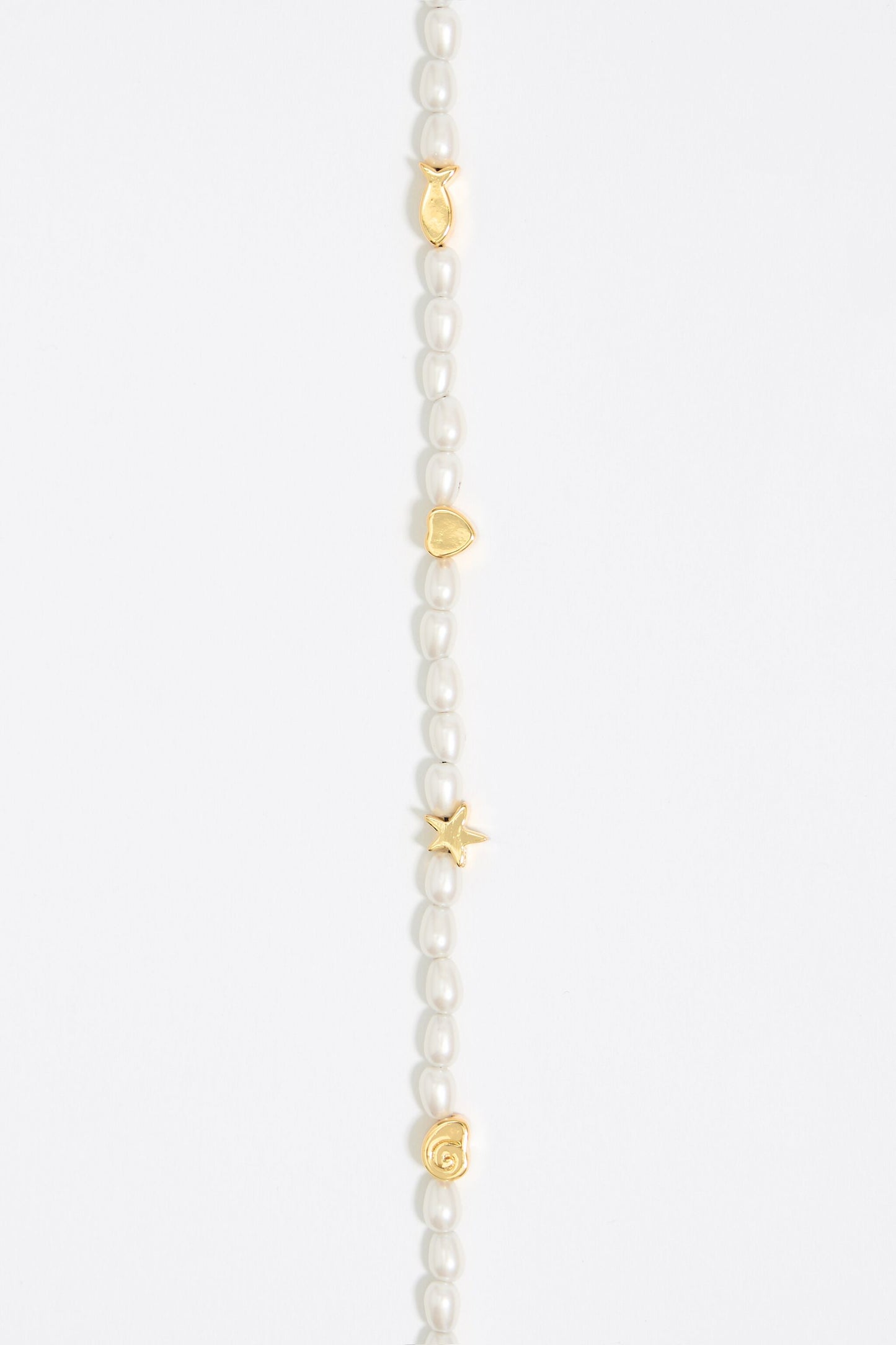 Gold marine motifs and pearl necklace