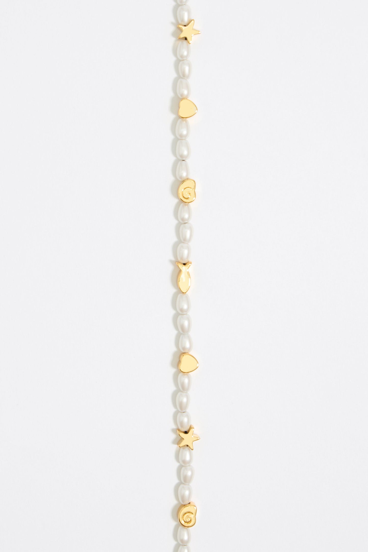 Gold marine motifs and pearl bracelet