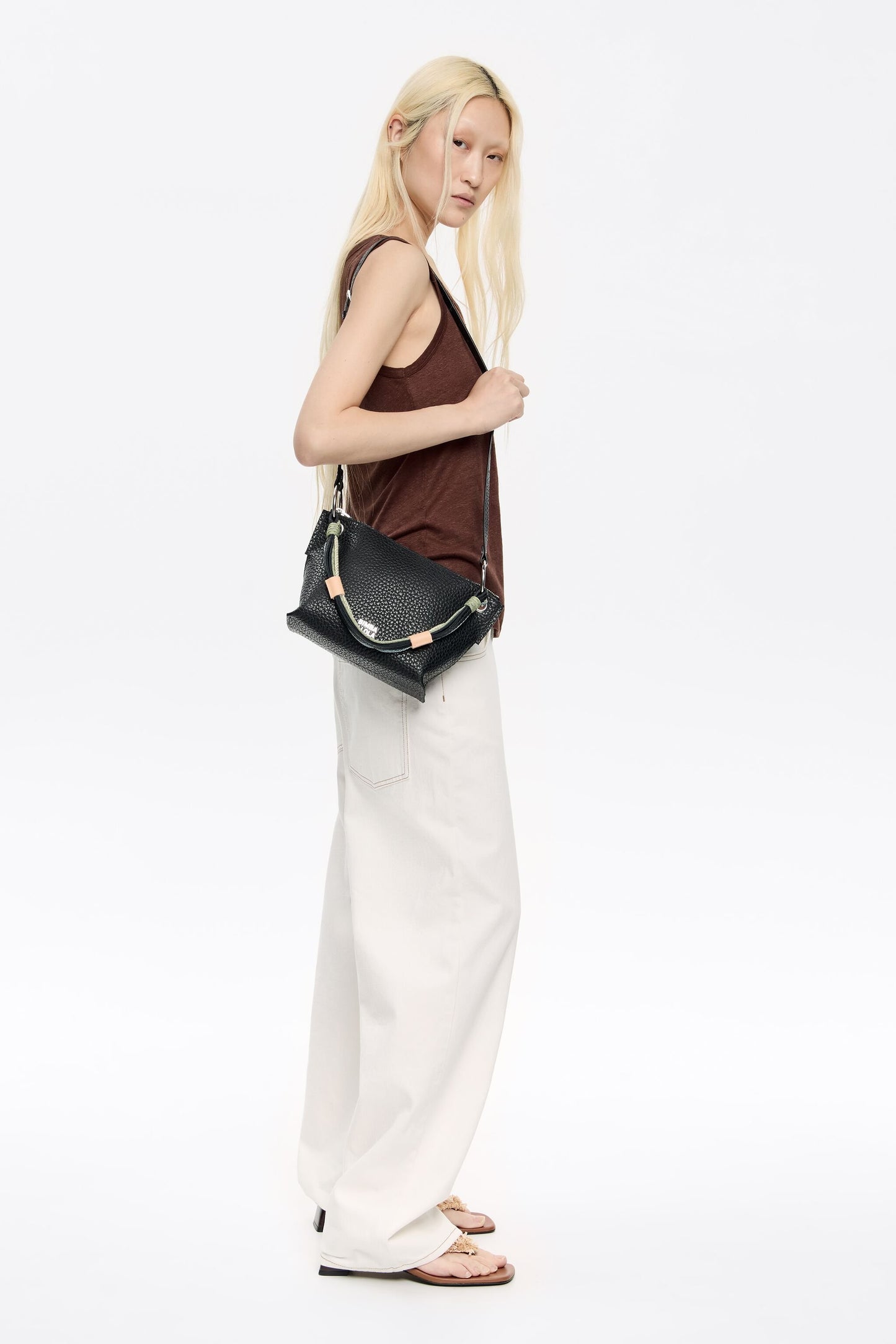 Medium black leather trapezium bag