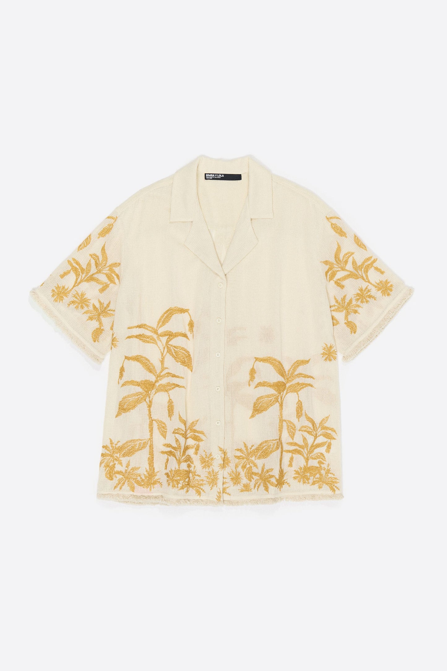 Oversize vanilla shirt with embroidery and frayed details