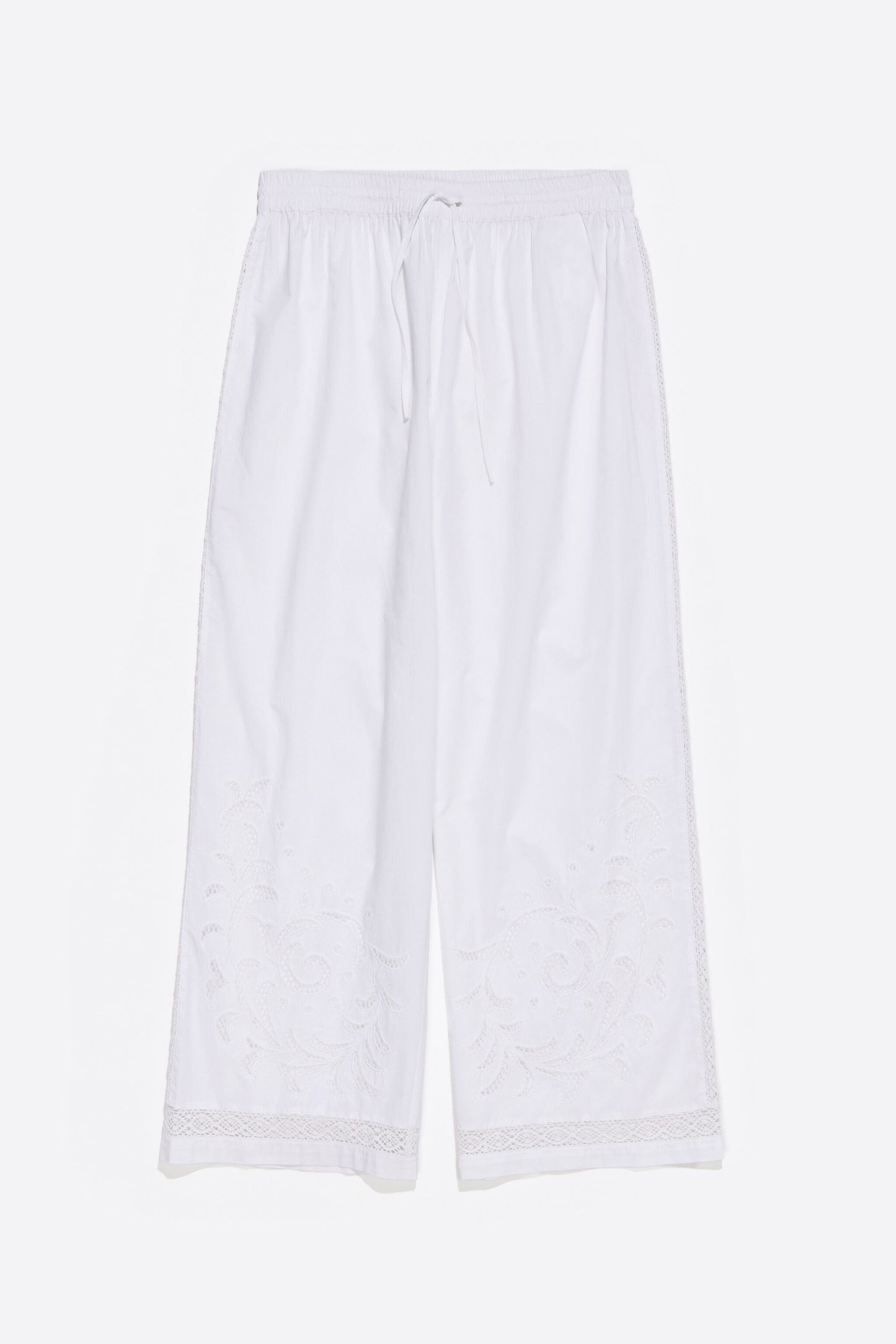 White embroidered jogger trousers
