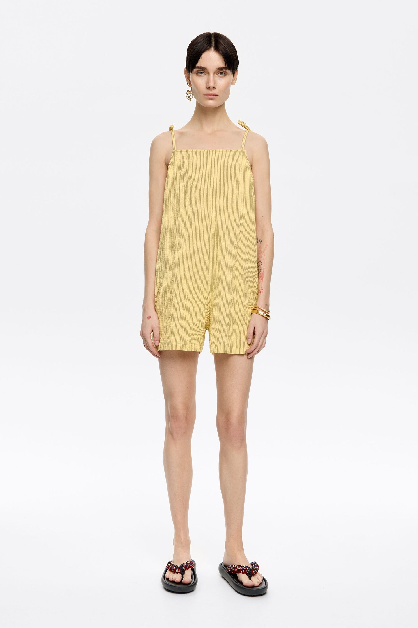 Short yellow striped jumpsuit