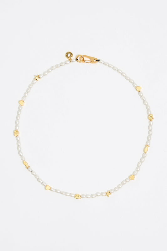 Gold marine motifs and pearl necklace