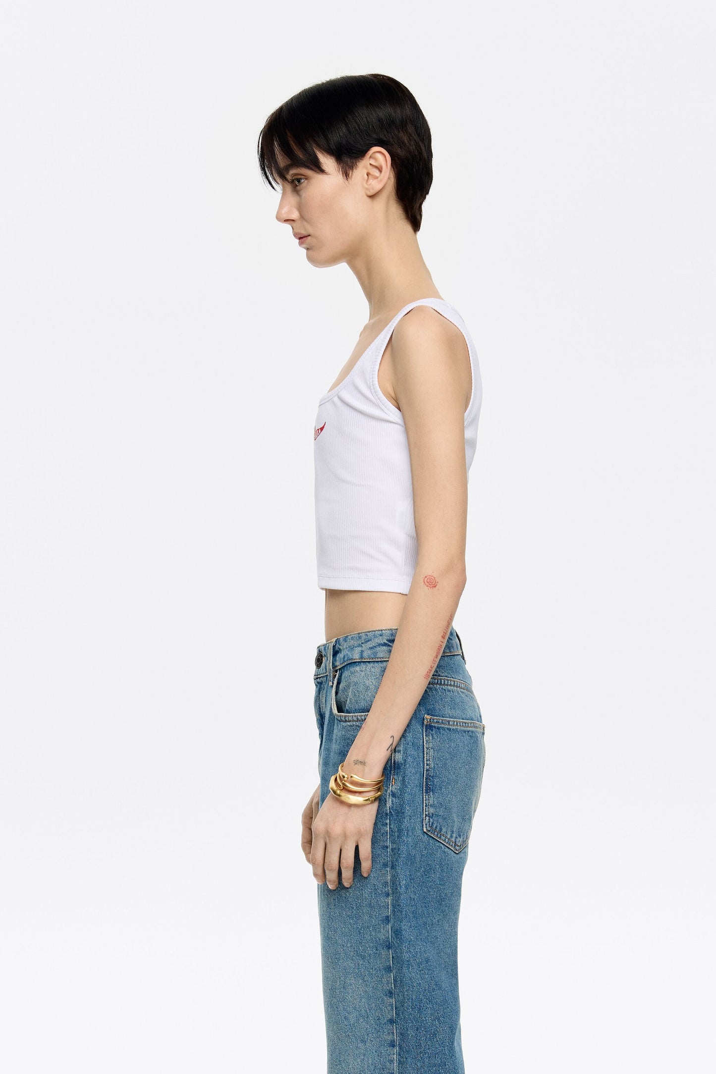 White short top with chili pepper logo