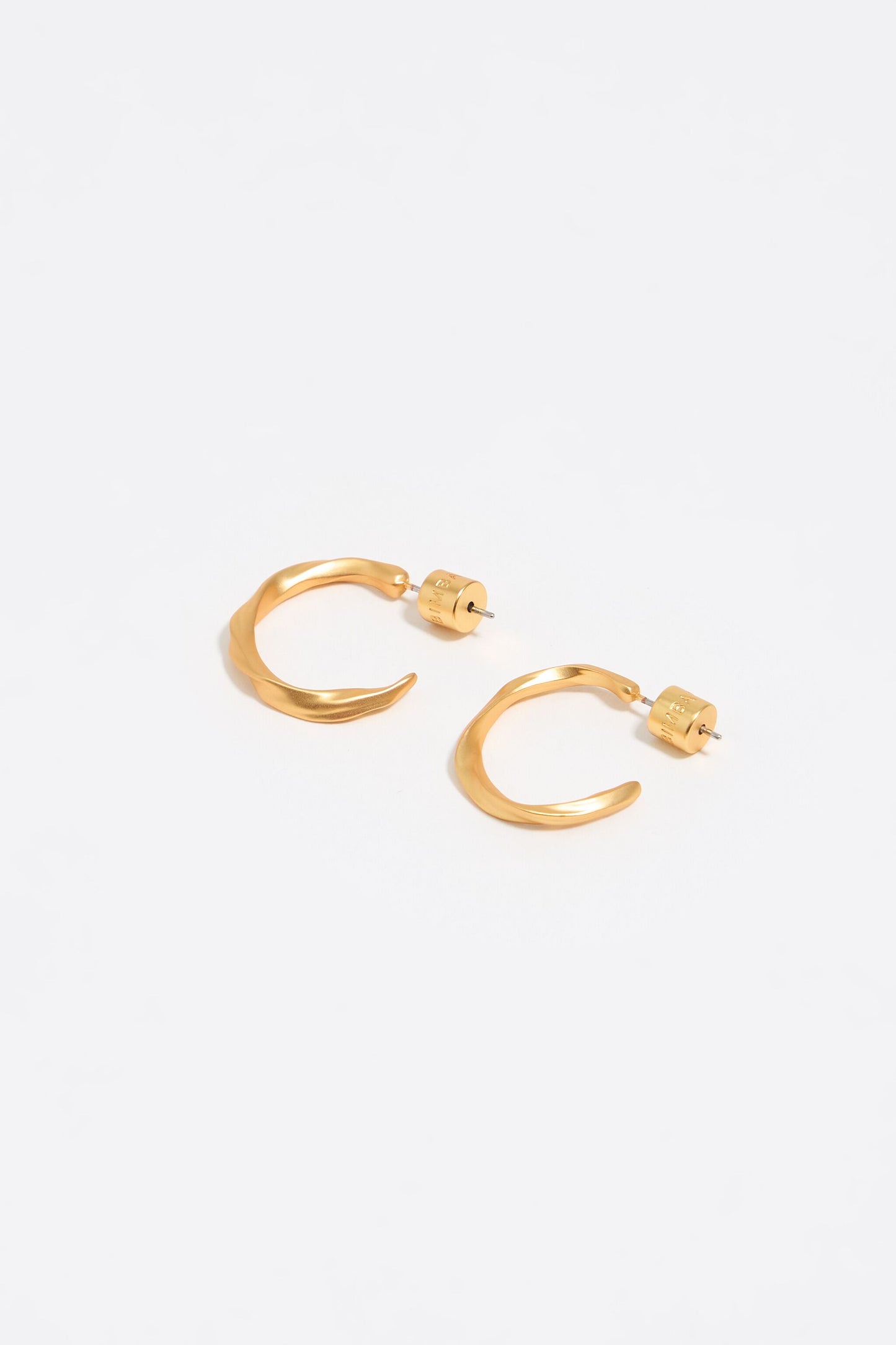 Matte gold uneven hoop earrings